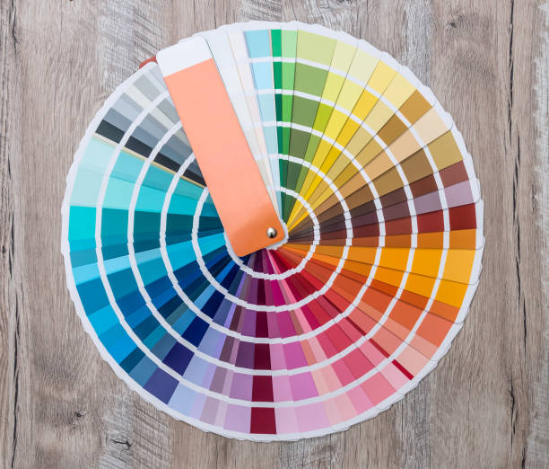 istock Colour swatch on wooden background lay out in circle 944493120