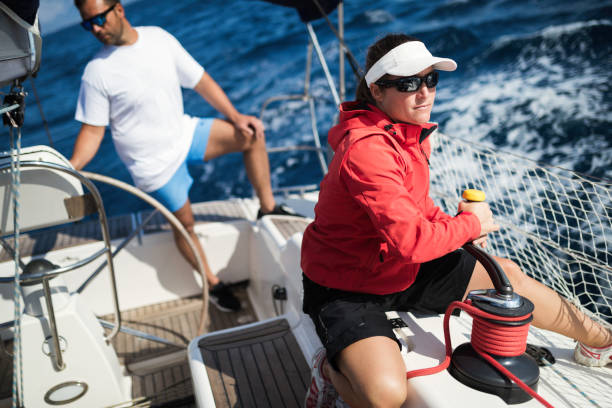 istock Attractive strong woman sailing with her boat 944494360