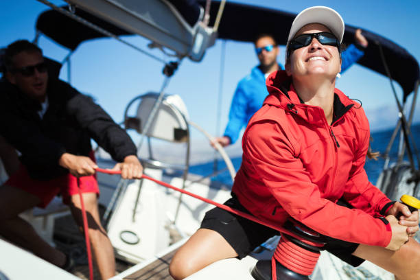 istock Attractive strong woman sailing with her boat 944495710