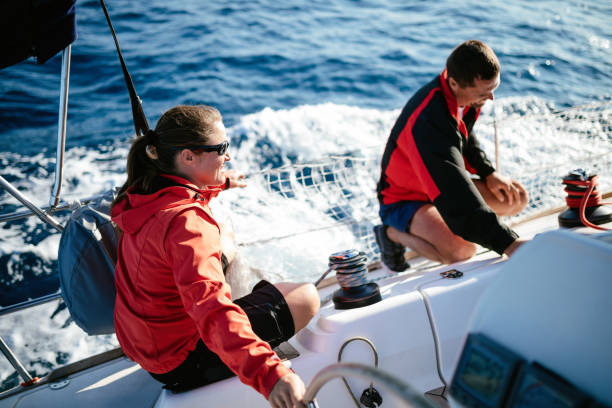 istock Attractive strong woman sailing with her boat 944496574