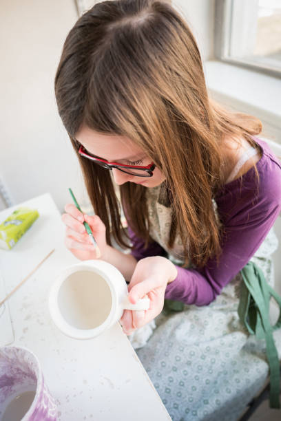 istock Teenage girl at pottery workshop 944497474