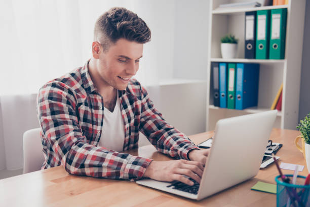 istock Happy smiling guy  chatting on the Internet 944501612