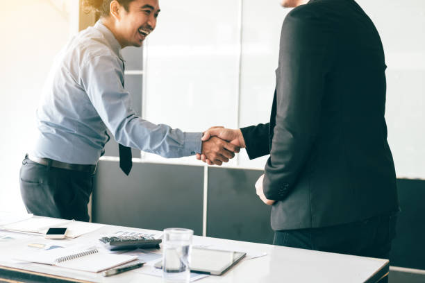 istock Business people shaking hands in conference room 944502824