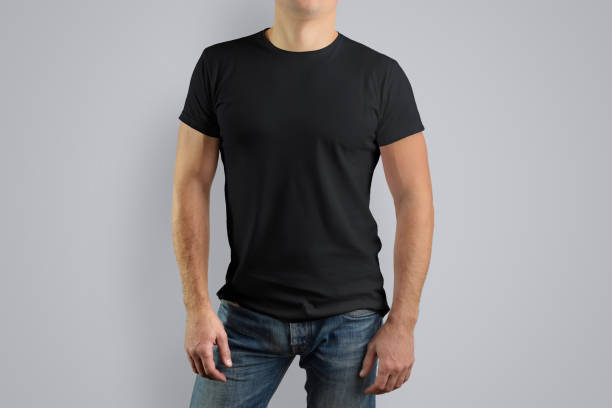 istock Man in a black t-shirt is isolated on a gray background 944506612