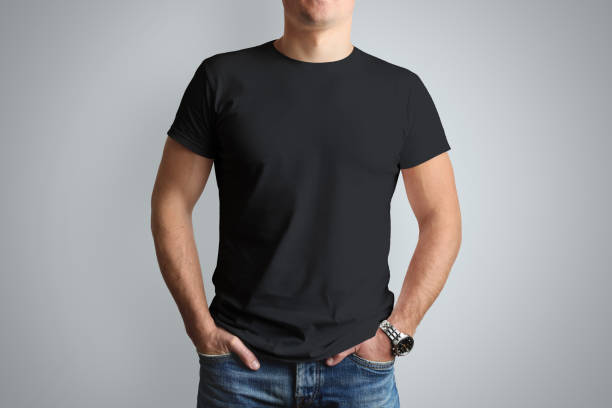 istock Front mockup black T-shirt on a young  guy isolated on a gray background. 944506694