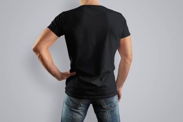 istock Mockup  black T-shirt on a back strong man in blue jeans. 944506992