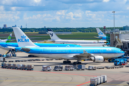 KLM Airbus A330-200 waiting at the gate at Schiphol Airport in the Netherlands.