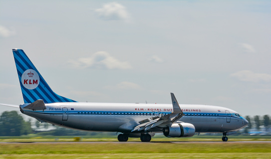 KLM Boeing 737 landing at Schiphol airport. The plane is fitted with special retro livery to celebrate 90 years of Royal Dutch Airlines.