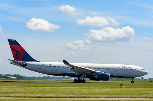 Delta Airlines Airbus A330 landing at Schiphol airport near Amsterdam in The Netherlands.