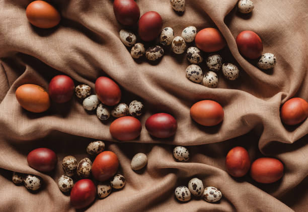 istock top view of easter painted eggs and quail eggs on linen tablecloth 944518700
