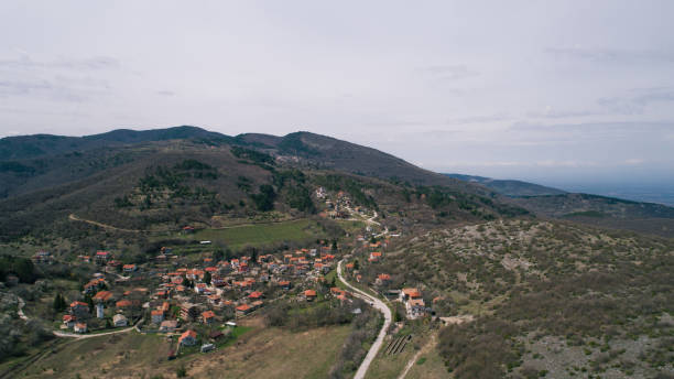 istock Mountains With Small Road And Town 944519750