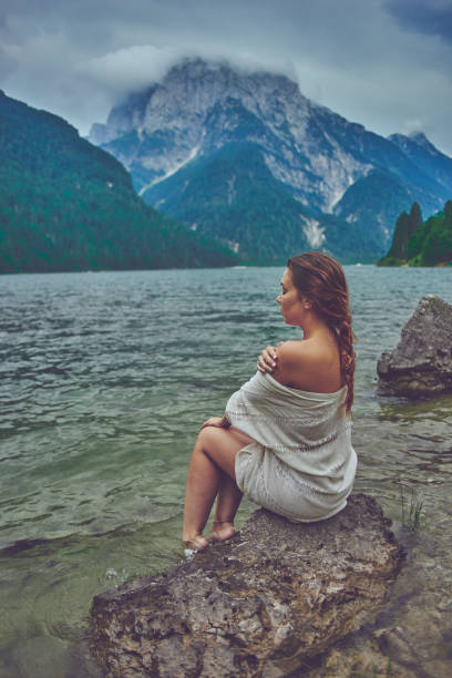 istock Lady at the lake 944530628