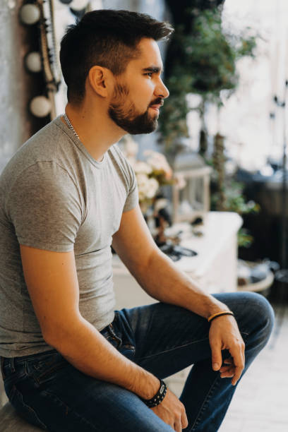 istock Side view portrait of a bearded man that is looking away . 944533308