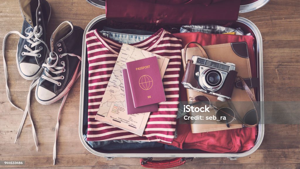 Travel suitcase preparing concept Suitcase Stock Photo