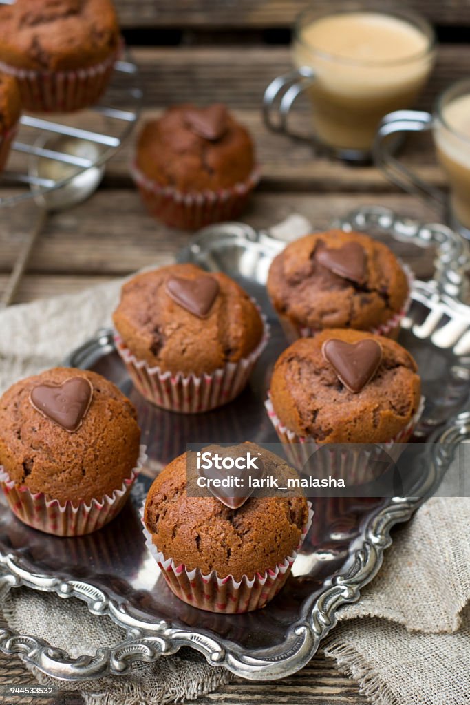 Chocolate muffins with chocolate chips and chocolate heart Sweet chocolate muffins with chocolate chips and chocolate heart Baked Stock Photo