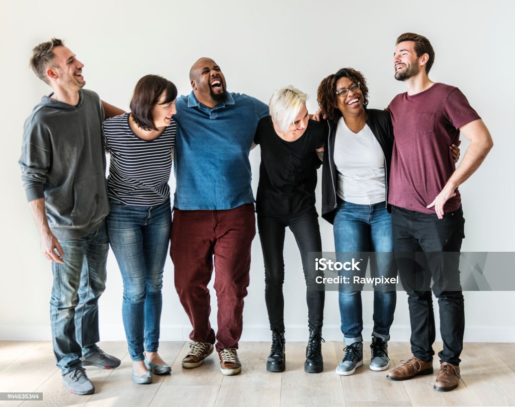 Happy diverse friends standing in a row Multiracial Group Stock Photo