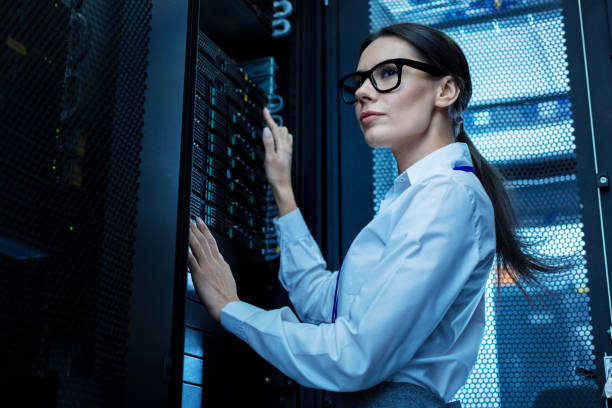 istock Inspired woman working in a server rack 944536588