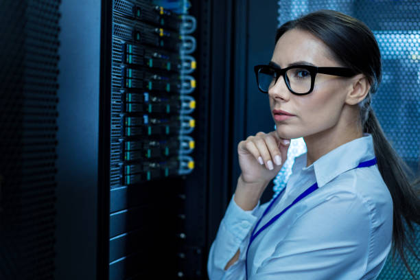 istock Concentrated young woman working in a data center 944536798