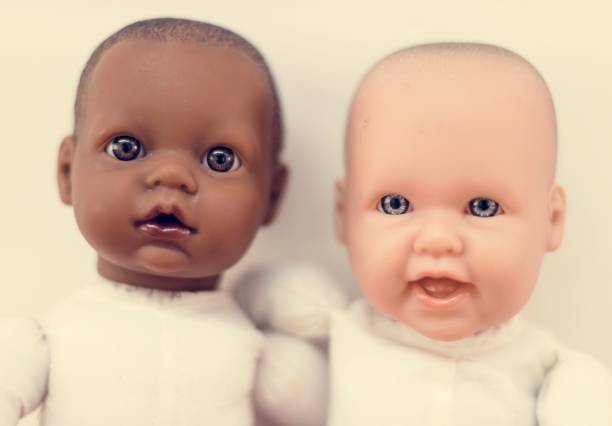 istock Caucasian and black baby doll 944536830