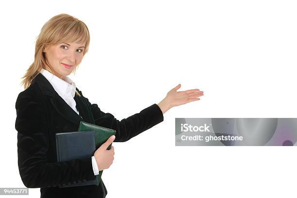 Portrait Of Businesswoman Pointing At Wall Stock Photo - Download Image Now - Adult, Adults Only, Beautiful People