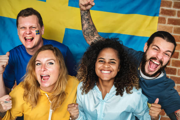 Friends cheering world cup with painted flag