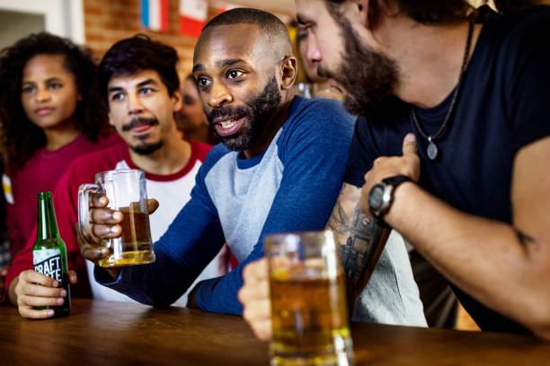 istock Friends cheering sport at bar together 944539934