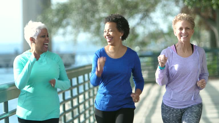 Three multi-ethnic mature and senior women exercising