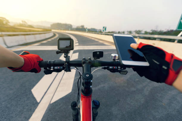 istock Cyclist using smartphone for navigation when riding mountain bike on highway 944542866