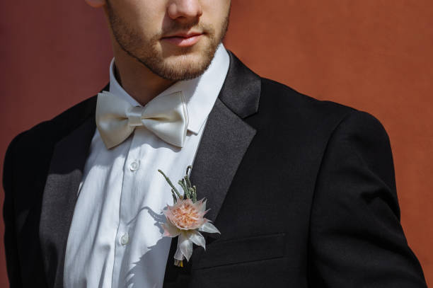 istock Stylish groom in a white butterfly 944546518