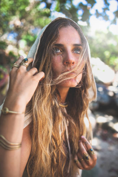 istock Beautiful young woman walking along a tropical beach 944549874