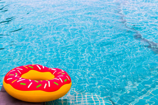 istock Swimming rubber ring with pink donut design 944550876