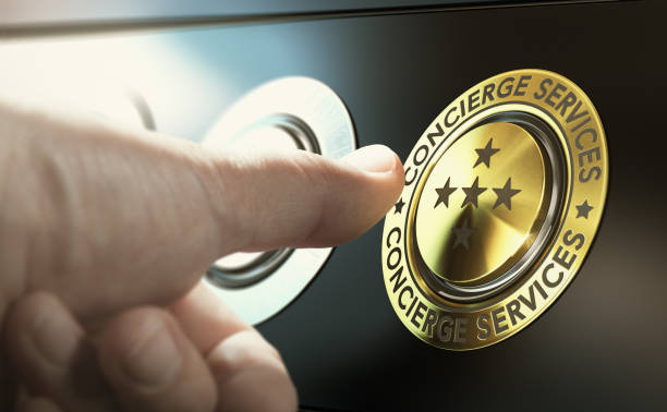Lifestyle Management and Concierge Services Man contacting concierge service by pushing a golden button. Composite image between a hand photography and a 3D background. concierge photos stock pictures, royalty-free photos & images