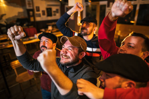istock Watching soccer game in the bar 944557344