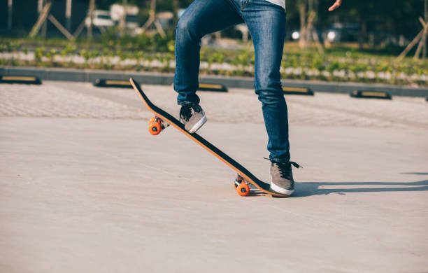 istock Skateboarder sakteboarding on parking lot 944558158