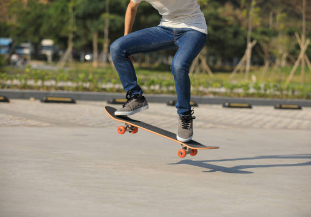 istock Skateboarder sakteboarding on parking lot 944558440