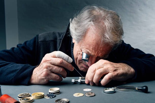 istock Close Up Portrait of a Watchmaker at Work 944559098