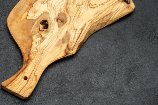 istock decorative wooden serving or cutting board on concrete background 944559128
