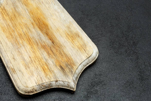 istock decorative wooden serving or cutting board on concrete background 944561686