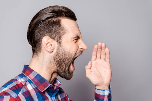 istock Side view of an angry man shouting isolated on gray background 944562172
