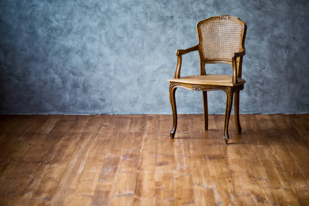 istock old chair on a gray wall background 944565198
