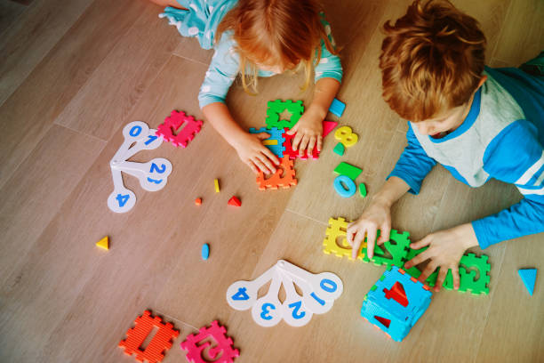 istock kids learning numbers, calculations, play with puzzle 944566216