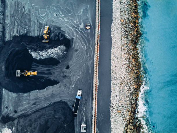 Coal mineral exploitation Aerial view of a coal mine quarry photos stock pictures, royalty-free photos & images