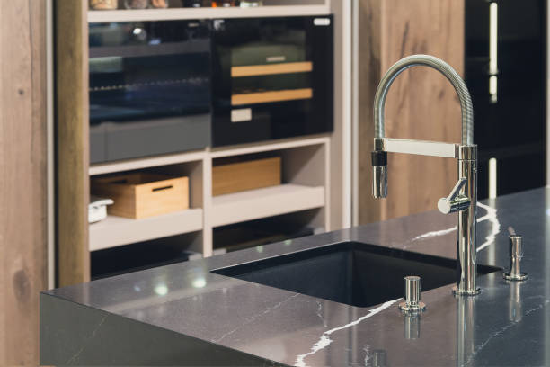 istock Stainless steel crane and marble countertop. Kitchen interior 944568992