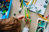child building robot at robotic technology school lesson
