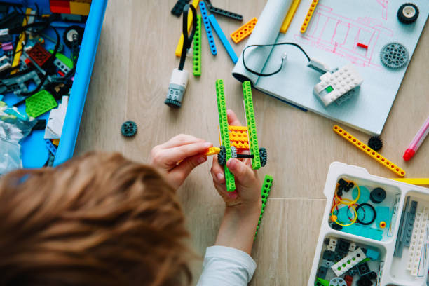 child building robot at robotic technology school lesson child building robot at robotic technology school lesson, STEM education stem topic stock pictures, royalty-free photos & images