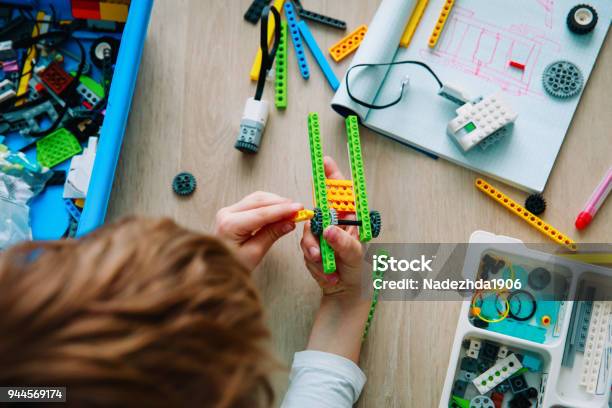 Child Building Robot At Robotic Technology School Lesson Stock Photo - Download Image Now