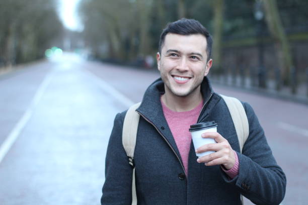 istock Joyful man starting the day with coffee 944574132