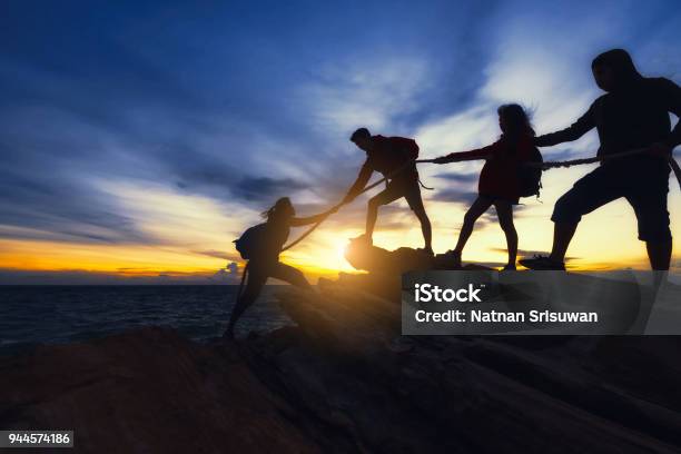 Climbing Up On The Mountain Stock Photo - Download Image Now - Teamwork, Mountain Climbing, Mountain