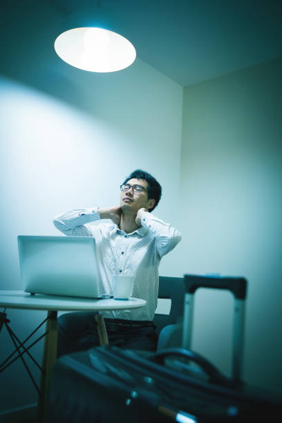 istock Work is very tiring on a business trip in hotel 944574202