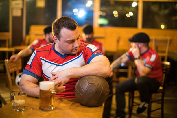 istock Friends in a pub watching football 944574754